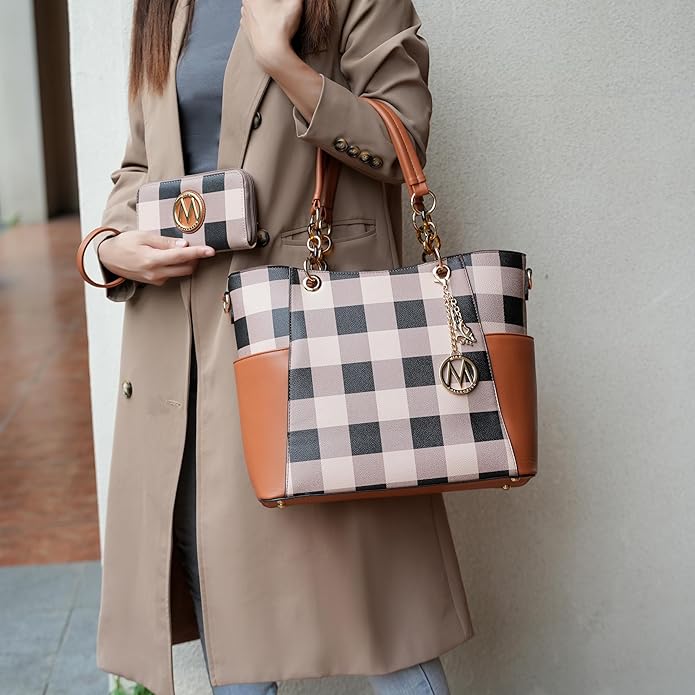 Handmade woven straw bag with leather handles on a wooden table